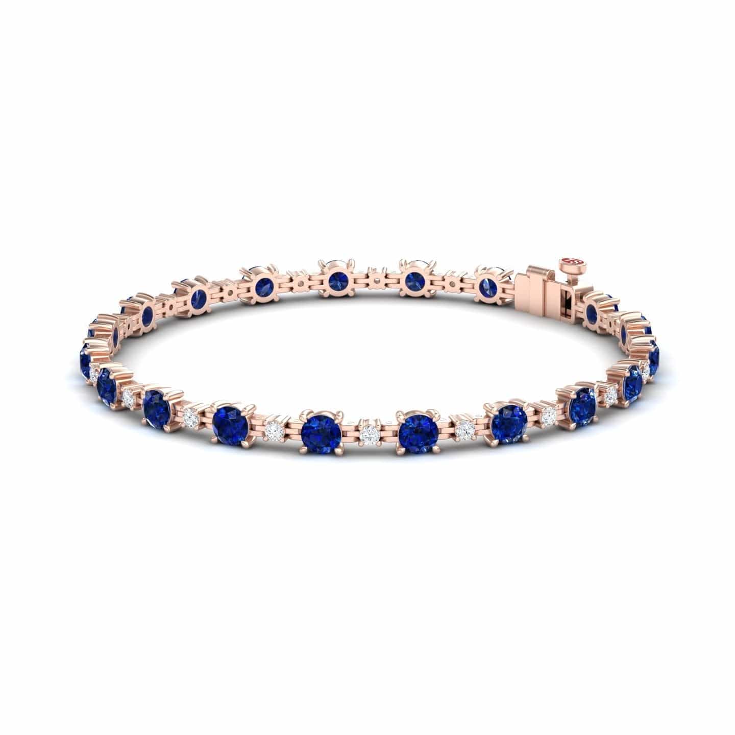 The Blue Sapphire & Diamond Tennis Bracelet - Natalia features a delicate rose gold design with evenly spaced round blue sapphires, sparkling diamonds, and a secure clasp for an elegant look.