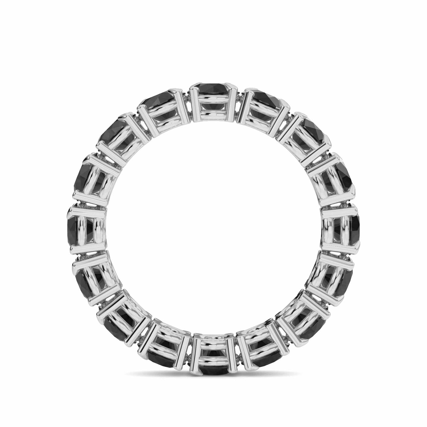 The Black Diamond Prong Set Eternity Band - Mehak is a silver ring featuring rectangular black gemstones set in a continuous circle, displayed on a white background.