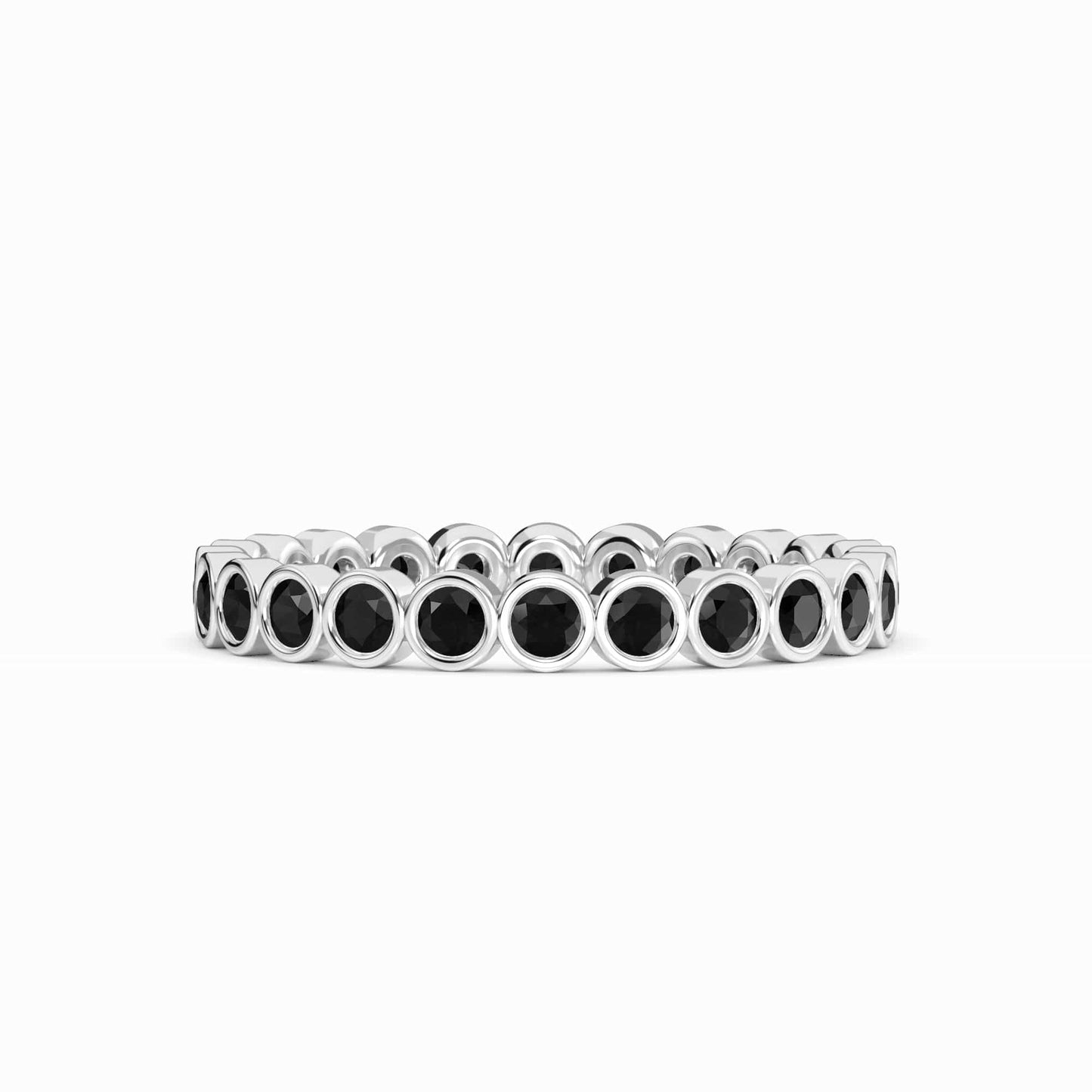 The Black Diamond Bezel Set Eternity Band Ring - Zara is a silver band with a continuous row of round black diamonds in bezel settings, shown against a plain white background.