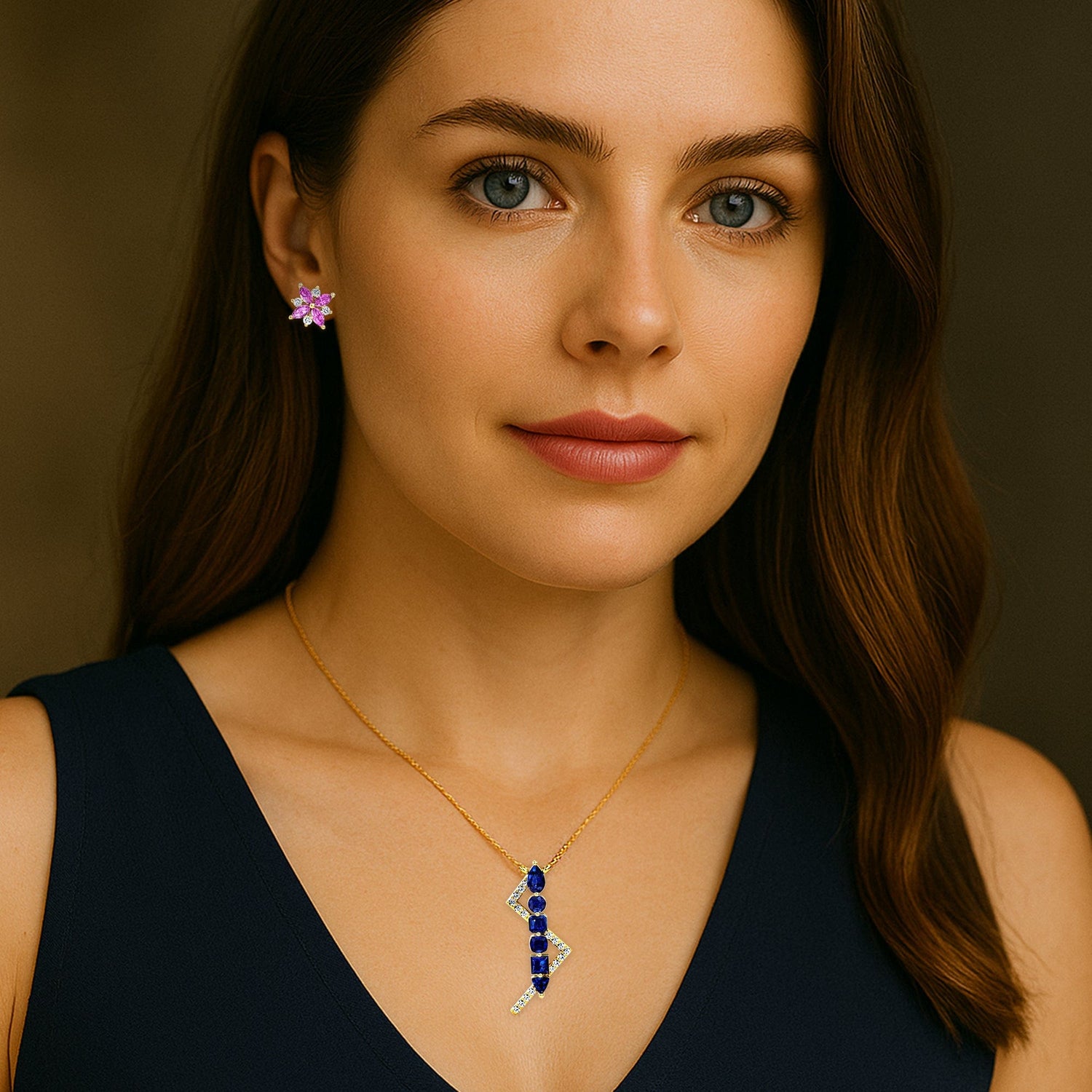 Woman wearing a necklace with a blue and silver pendant against a brown background