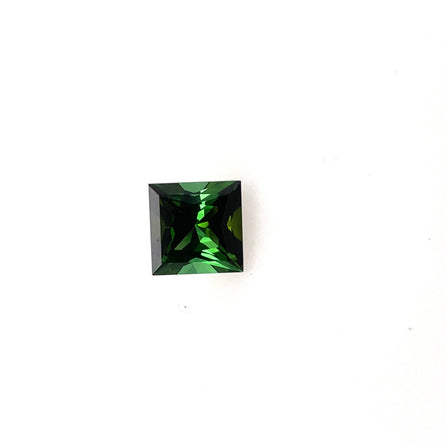 A 7.5mm Natural Green Tourmaline Square Princess gemstone with sharp facets is displayed on a plain white background.