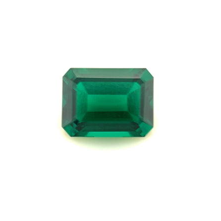 An 8x6 Exceptional Emerald Zambian Color Lab Created Emerald, rectangular and emerald-cut with faceted edges, shown on a plain white background.