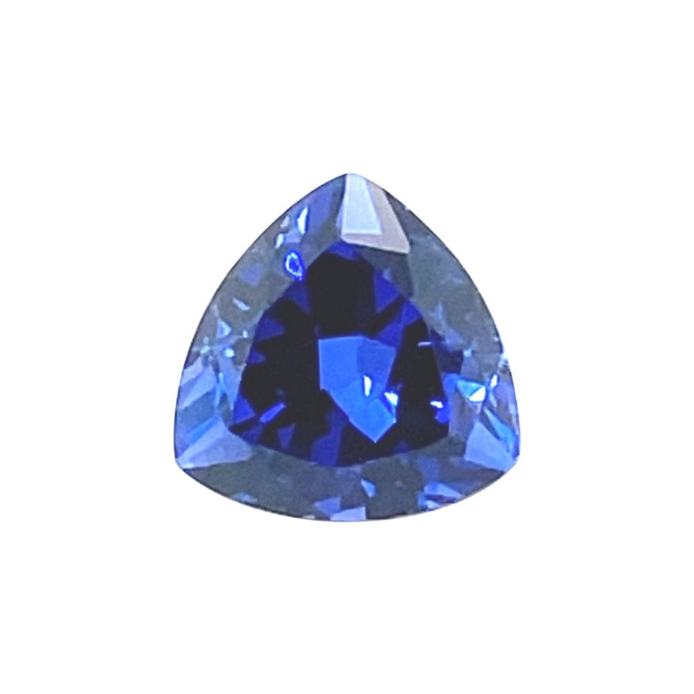 A brilliant blue 9mm Exceptional Pear Trillion Created Blue Sapphire with a sparkling surface and bold triangular shape, showcased against a plain white background.