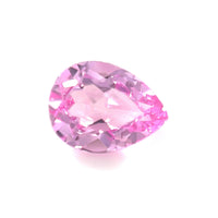 The 8.0x6.0 Exceptional Pear Lab Created Medium Pink Sapphire is shown against a white background, highlighting its vibrant medium pink color and brilliant cut.