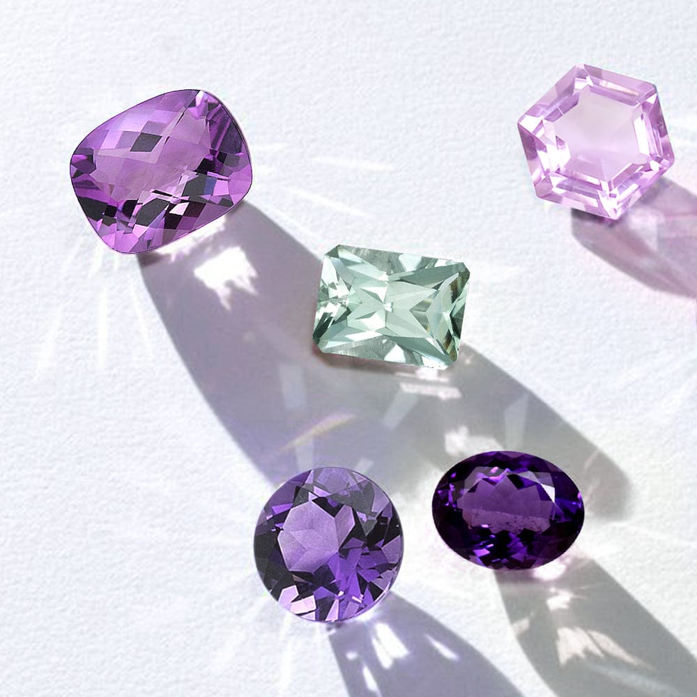 Five colorful amethyst gemstones on a white background