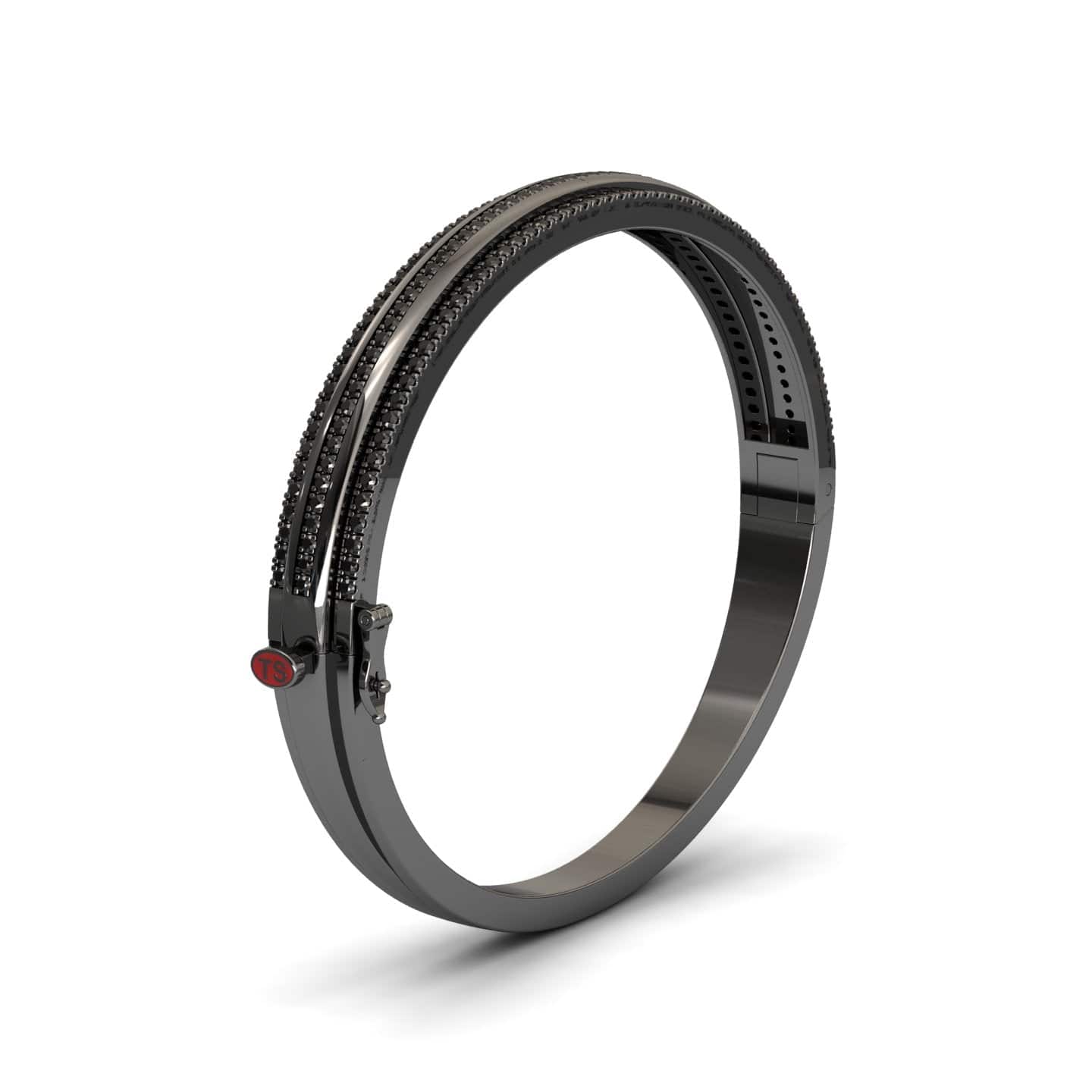 The Bold Black Bangle: Unconventional Elegance - Amalia features two rows of dark gemstones and a red circular accent near the clasp, all set in a sleek black finish and displayed on a white background.