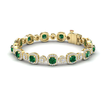 The Lab Grown Emerald & Diamond Tennis Bracelet - Erina showcases alternating round green lab-grown emeralds and white diamonds in decorative bezel settings with a secure clasp.