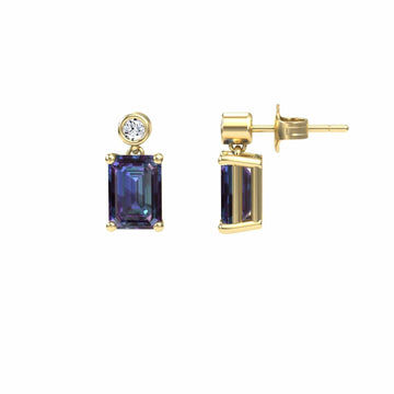A pair of Lab Grown Alexandrite & White Diamond Drop Earrings - Gracia, featuring emerald-cut alexandrites with round white diamonds above, shown from front and side views against a white background.