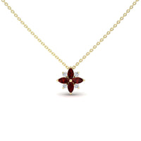 The Ruby & Diamond Flower Necklace - Keira features a gold chain with a flower pendant, adorned with four marquise-cut red gemstones as petals and four round white gemstones in a symmetrical design.