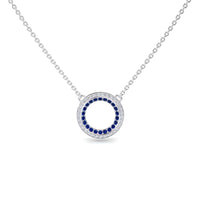 Blue Sapphire & Diamond Double Halo Circle Necklace - Mona: Features a circular pendant with a ring of blue sapphires encircled by diamonds, an open center, and is attached to a delicate chain.