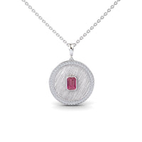 The Pink Tourmaline & Diamond Textured Medallion Necklace - Jasmine features a silver necklace with a round textured pendant, a border of clear diamonds, and a central rectangular pink tourmaline gemstone.