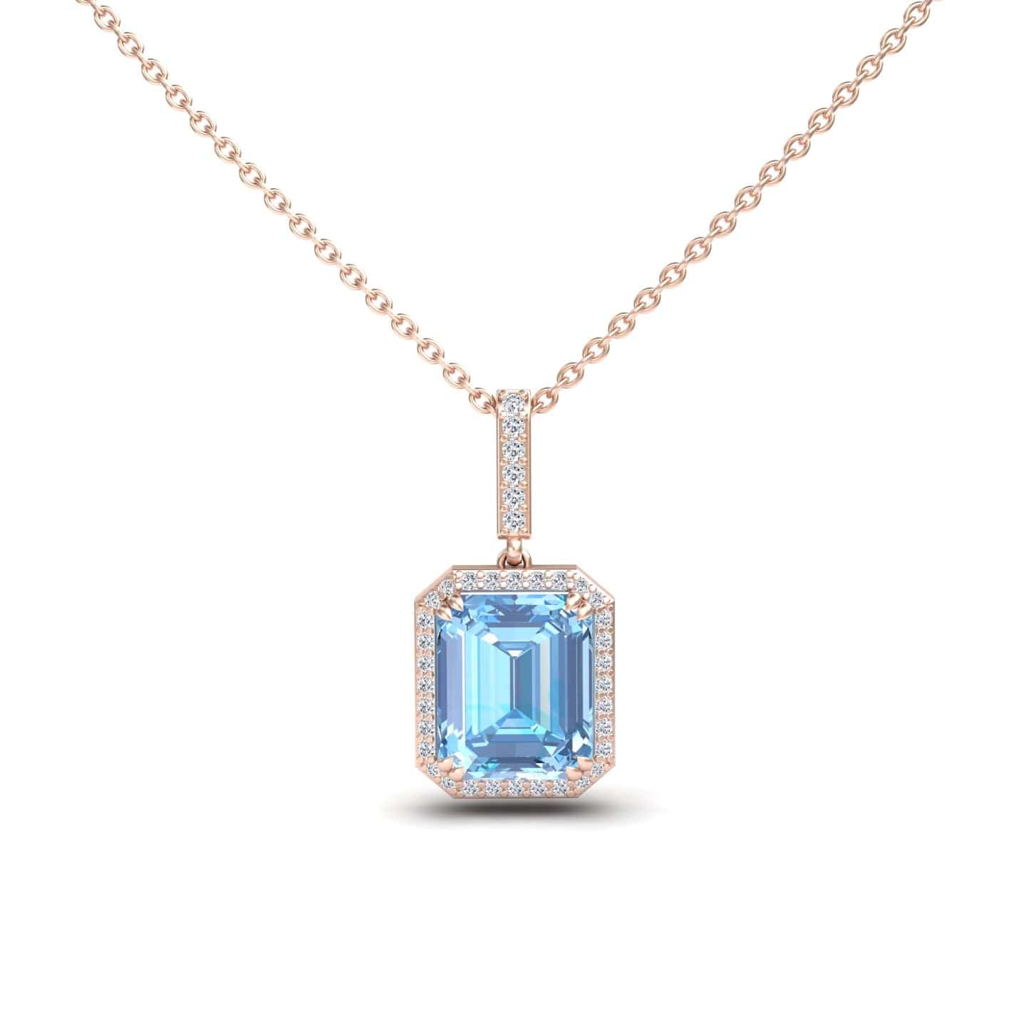 The Sky Blue Topaz & Diamond Halo Necklace - Sanya features a rose gold chain with a rectangular, emerald-cut sky blue topaz pendant surrounded by small clear diamonds.