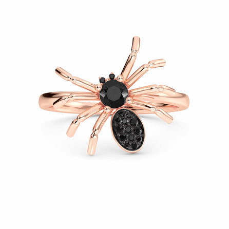 The Black Diamond Spider Statement Ring - Ainsley is a rose gold ring with black gemstones forming the spider’s body and head, showcased against a white background.