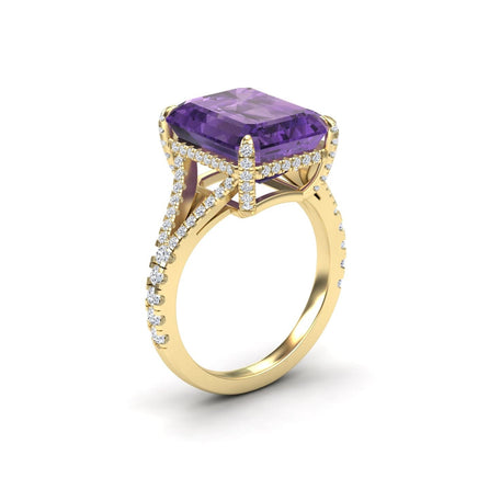 The Amethyst & Diamond Cocktail Ring - Ziya features a large rectangular amethyst center stone, accented with sparkling white diamonds along the band and prongs in an intricate gold setting.