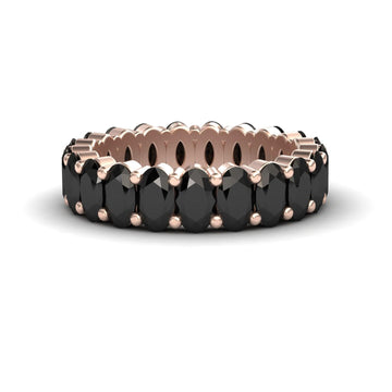 The Black Diamond Full Eternity Band - Diana showcases a continuous row of oval black gems in rose gold prong settings, displayed on a white background.
