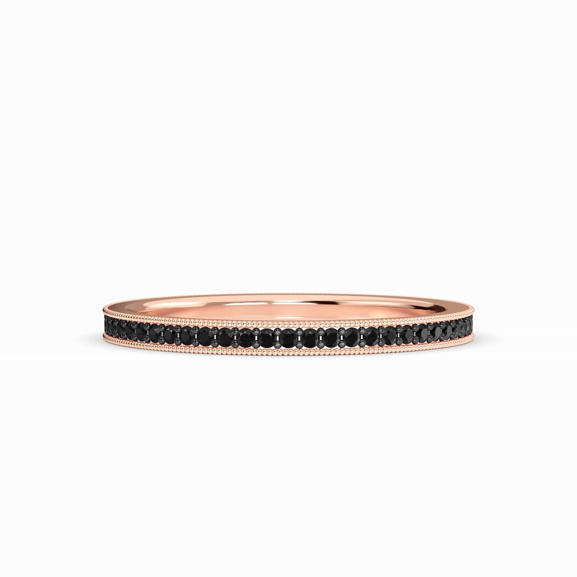 The Black Diamond Milgrain Eternity Pave Band - Mariel is a slim rose gold ring with a row of black diamonds set along the band, shown against a plain white background.