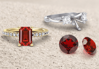 Two gold rings with red gemstones and a silver ring with diamonds on a beige background.