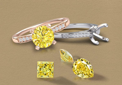 Two diamond rings with yellow diamond gemstones on a beige background