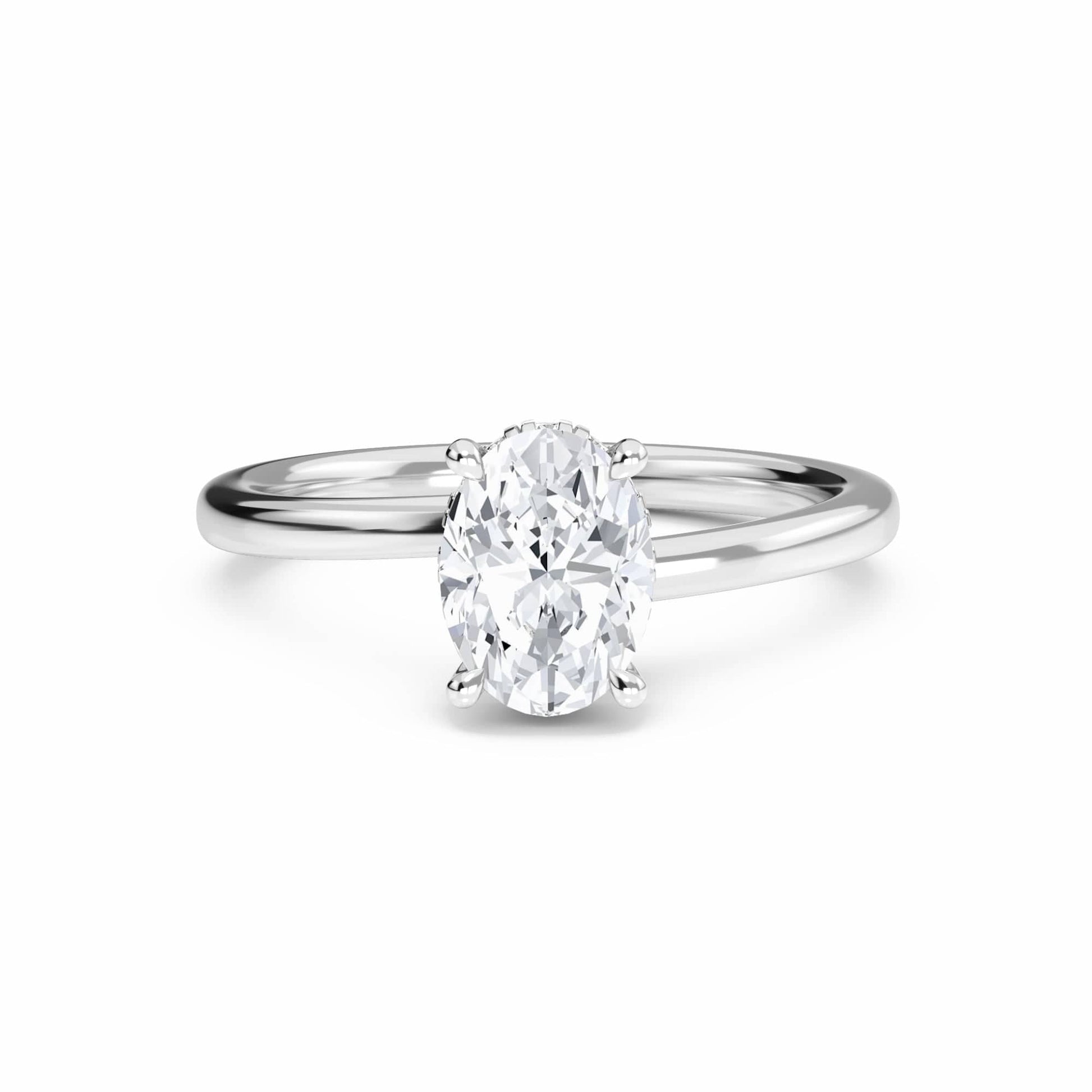 The Lyric White Diamond Hidden Halo Solitaire Engagement Ring in 18K white gold features a 0.200 carat oval diamond, E color, VS1 clarity, set in a four-prong setting and displayed on a white background.
