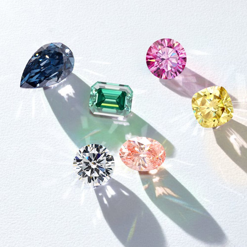 Collection of colorful moissanites on a light background