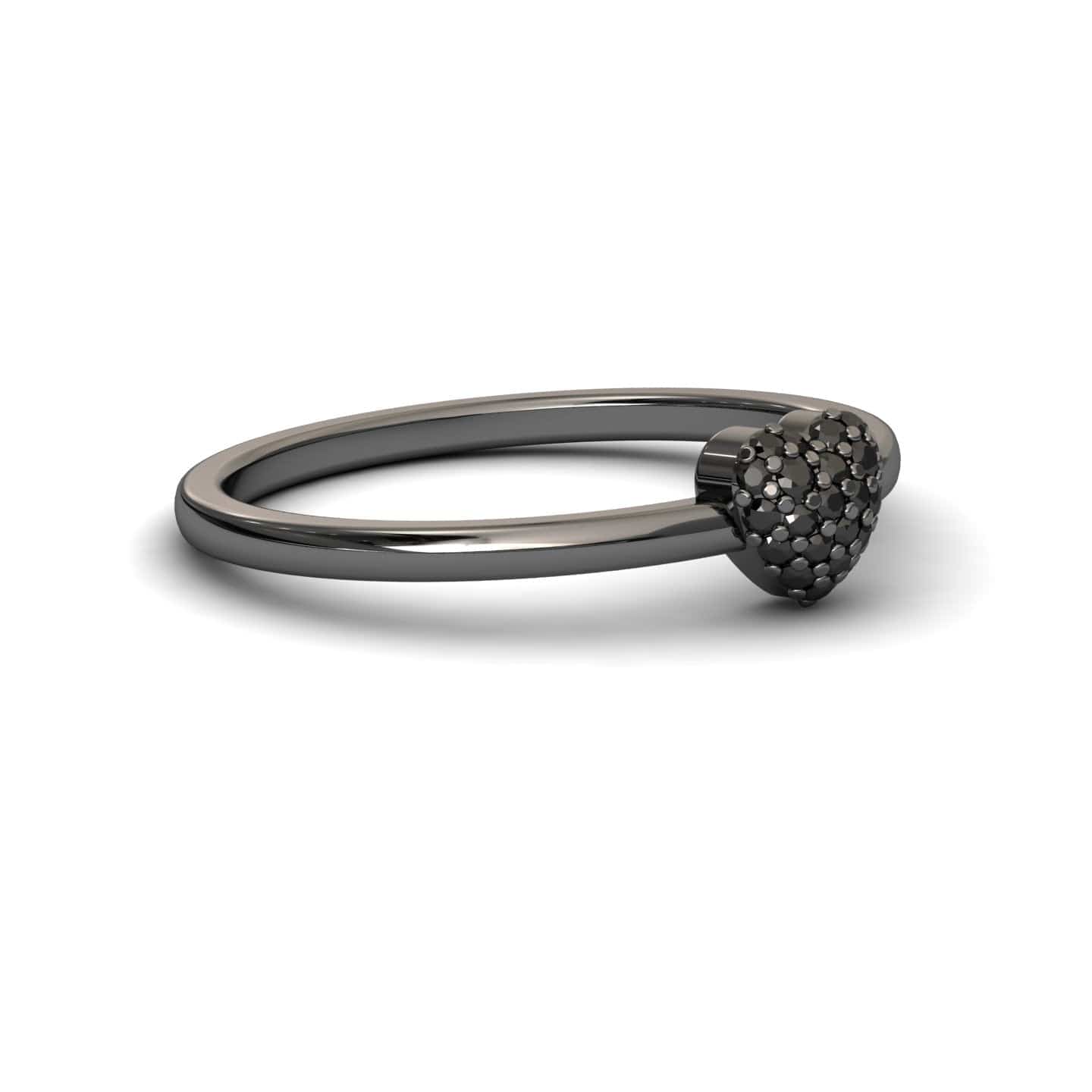 The Black Diamond Pave Heart Ring - Bonita is a sleek black metal ring with a small, textured heart adorned with sparkling pave stones on top, shown against a white background.